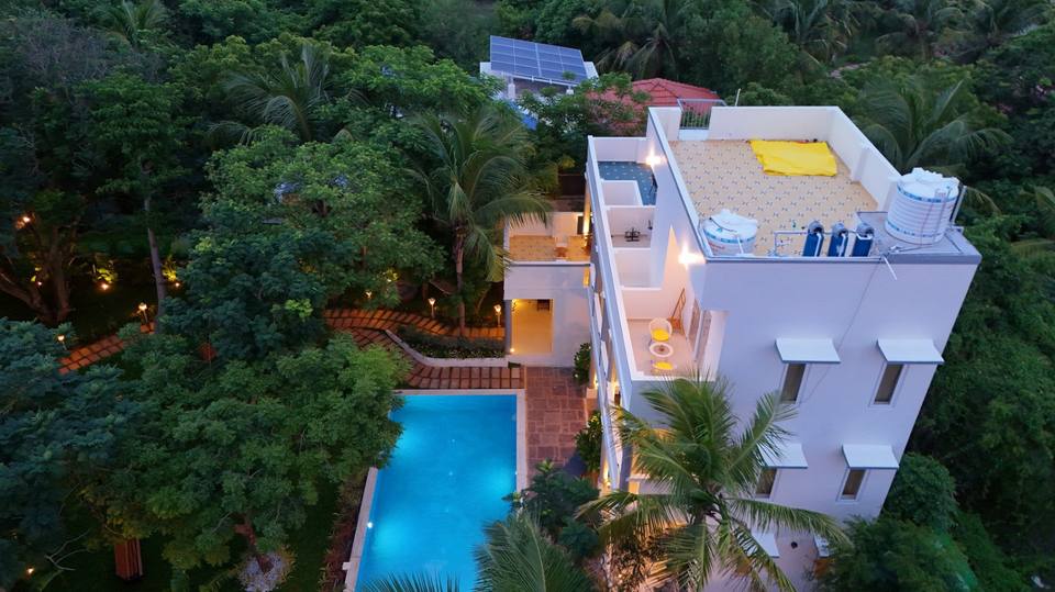 The villa and pool at dusk