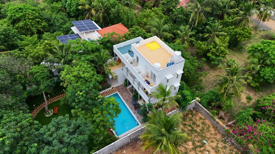 The villa, pool, garden and rooftop terraces from above