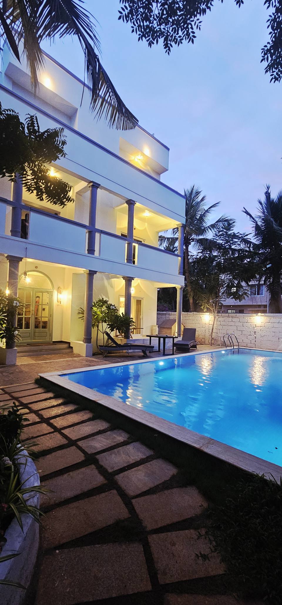 The villa and pool at dusk