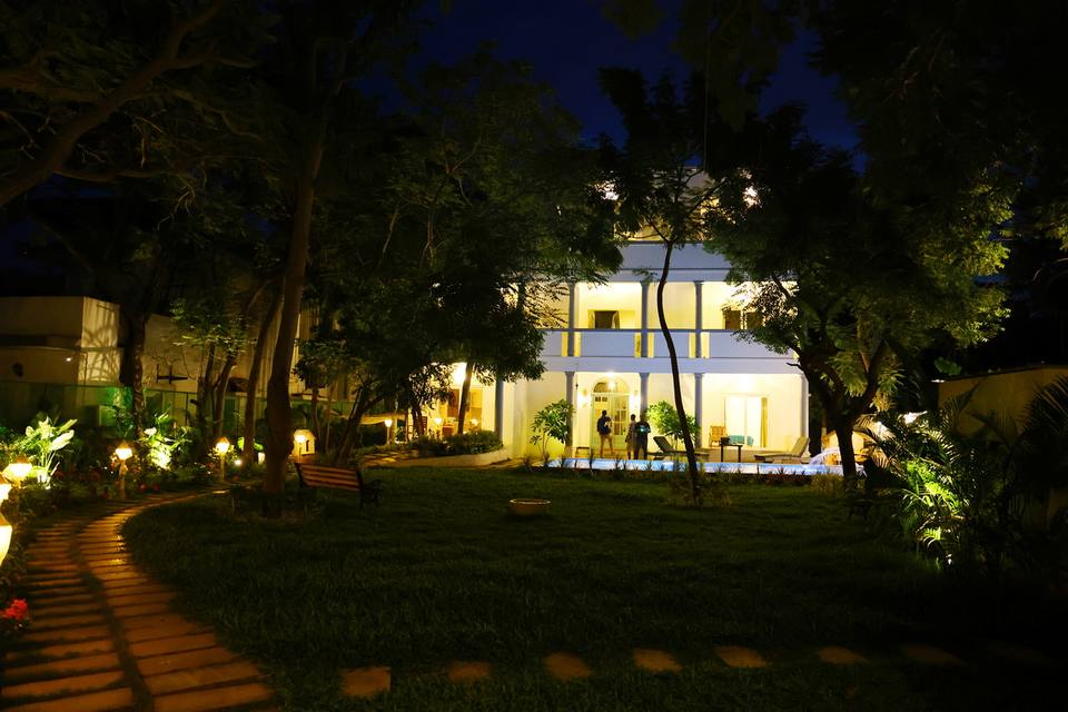 The villa lit up at night